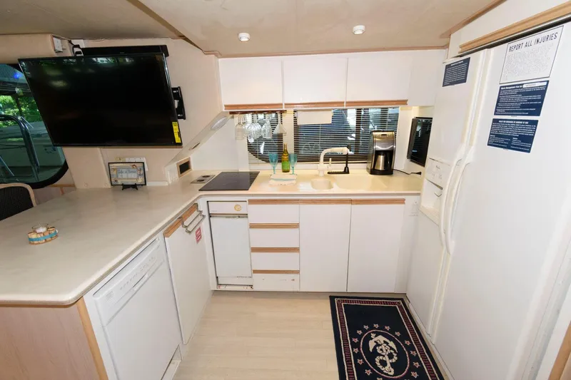 Slide: The Image of Modern kitchen in 1997 Bluewater Yachts 680 Custom Series with appliances and ample counter space. - 18