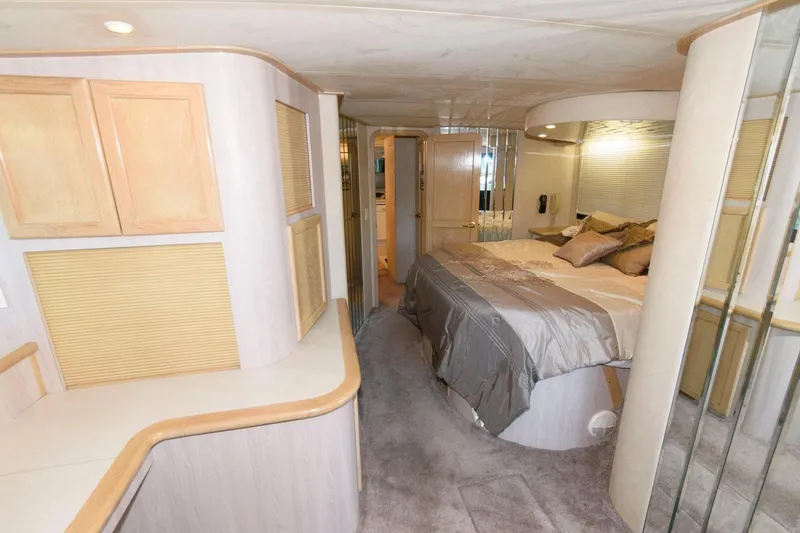Slide: The Image of Luxurious bedroom interior of 1997 Bluewater Yachts 680 Custom Series with modern furnishings. - 23