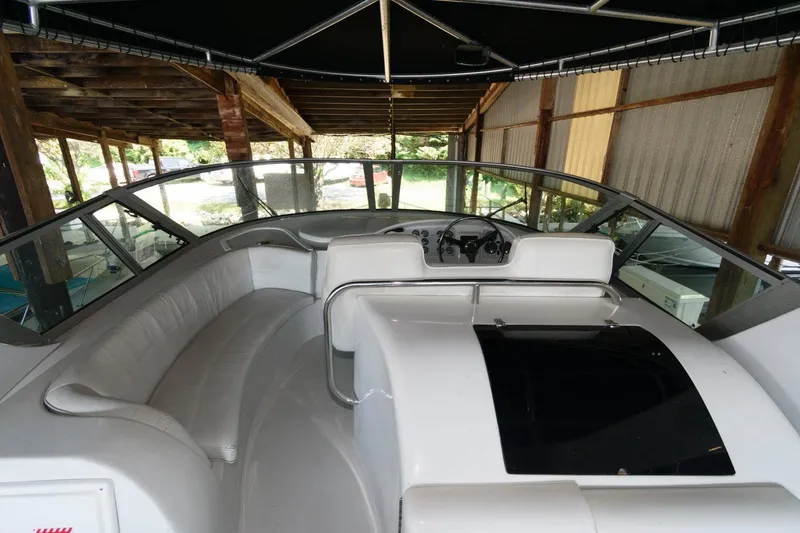 Slide: The Image of 1997 Bluewater Yachts 680 Custom Series interior cockpit under a covered dock. - 4
