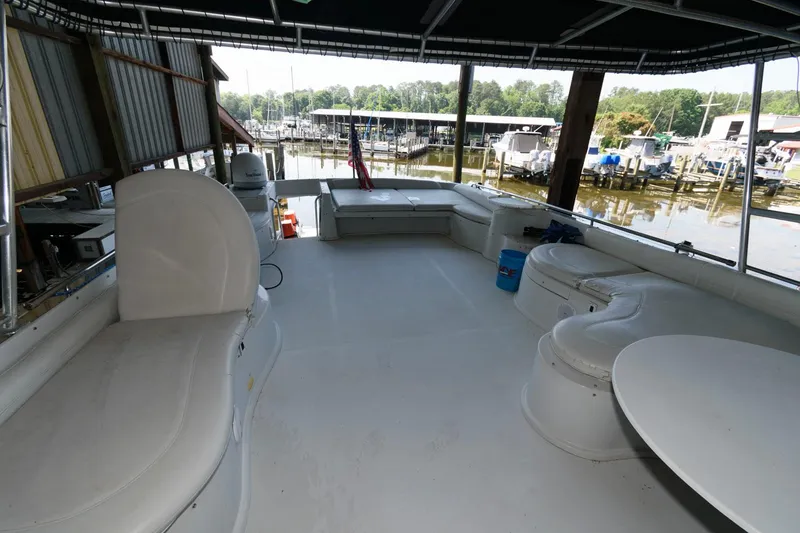 Slide: The Image of Spacious deck of 1997 Bluewater Yachts 680 Custom Series at marina. - 9