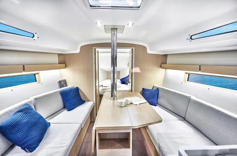 Slide: The Image of Interior of 2024 Beneteau Oceanis 34.1 sailboat, featuring modern seating and wooden finishes. - 15