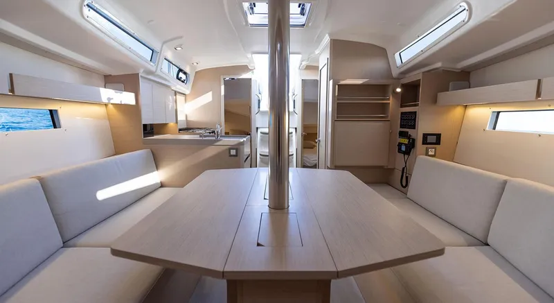 Slide: The Image of Interior of 2024 Beneteau Oceanis 34.1 yacht, featuring modern seating and dining area. - 18