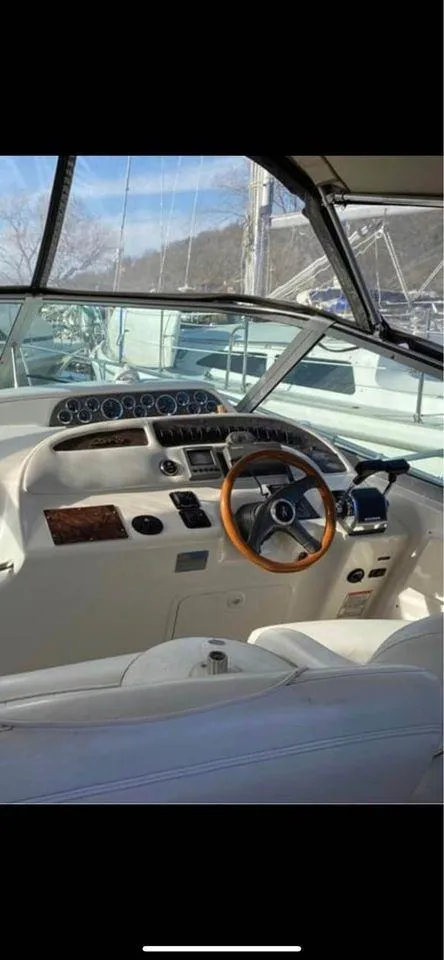 Slide: The Image of Interior view of a 1998 Sea Ray Sundancer 310 cockpit. - 4