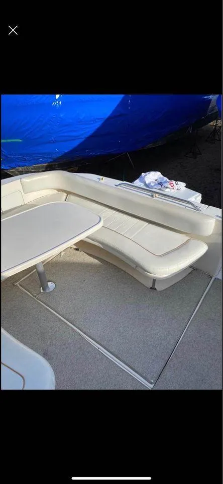 Slide: The Image of 1998 Sea Ray Sundancer 310 boat interior seating area. - 5