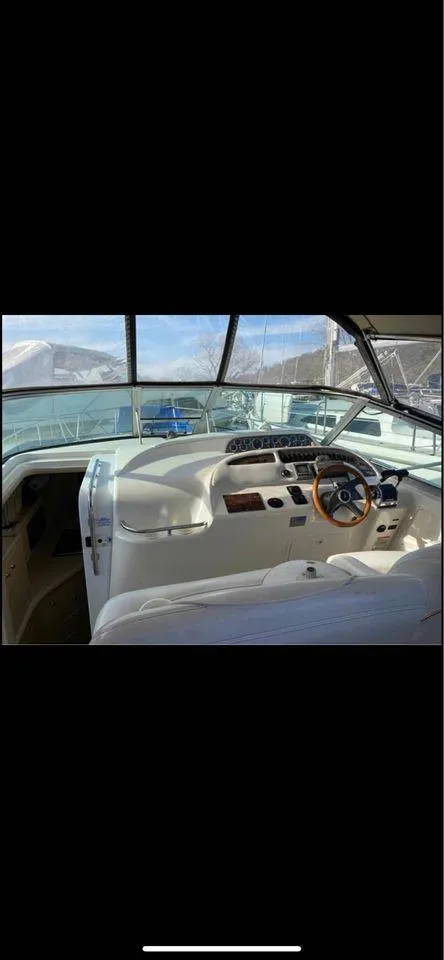 Slide: The Image of 1998 Sea Ray Sundancer 310 boat interior cockpit view. - 6