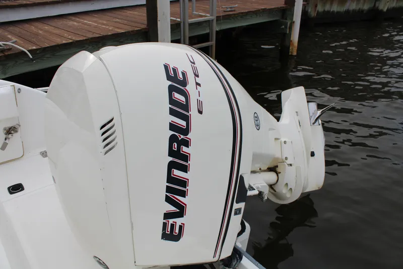 Slide: The Image of 1999 Boston Whaler Outrage 23 with Evinrude E-TEC outboard motor. - 11