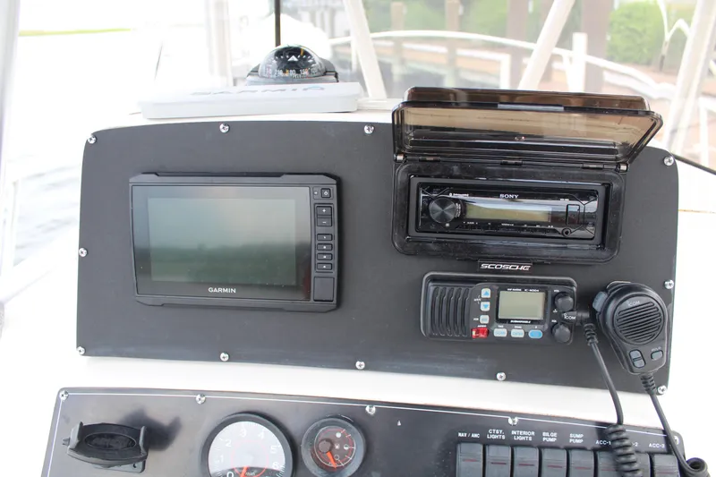 Slide: The Image of 1999 Boston Whaler Outrage 23 console with Garmin GPS, Sony stereo, and marine radio. - 5