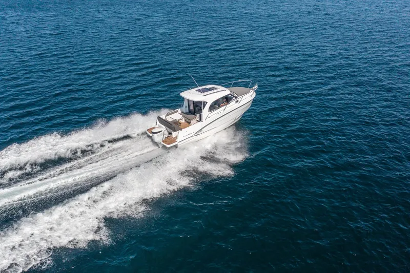 Slide: The Image of 2023 Antares 8 V2 boat cruising on open water. - 10