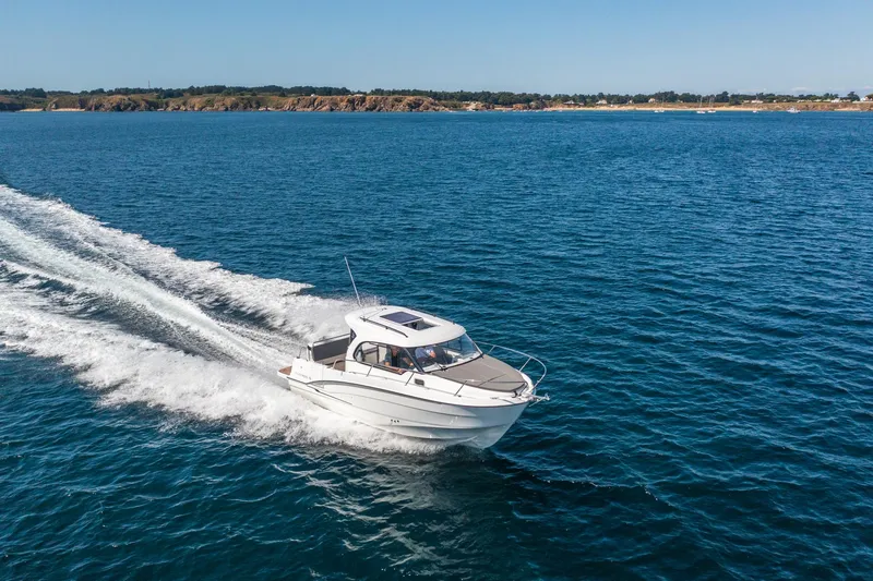 Slide: The Image of 2023 Antares 8 V2 boat cruising on open water. - 12