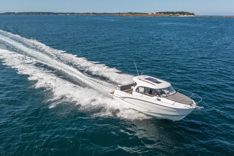 Slide: The Image of 2023 Antares 8 V2 motorboat cruising on open water. - 13