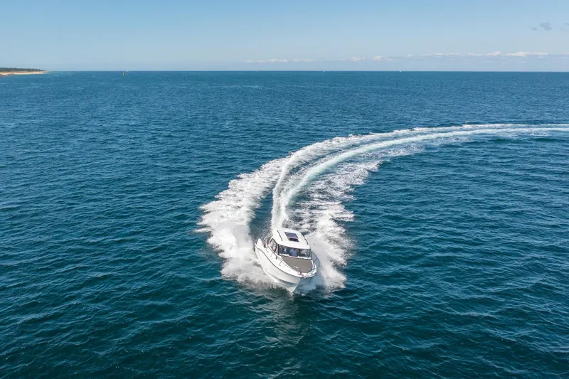 Slide: The Image of 2023 Antares 8 V2 boat cruising on open blue sea. - 14