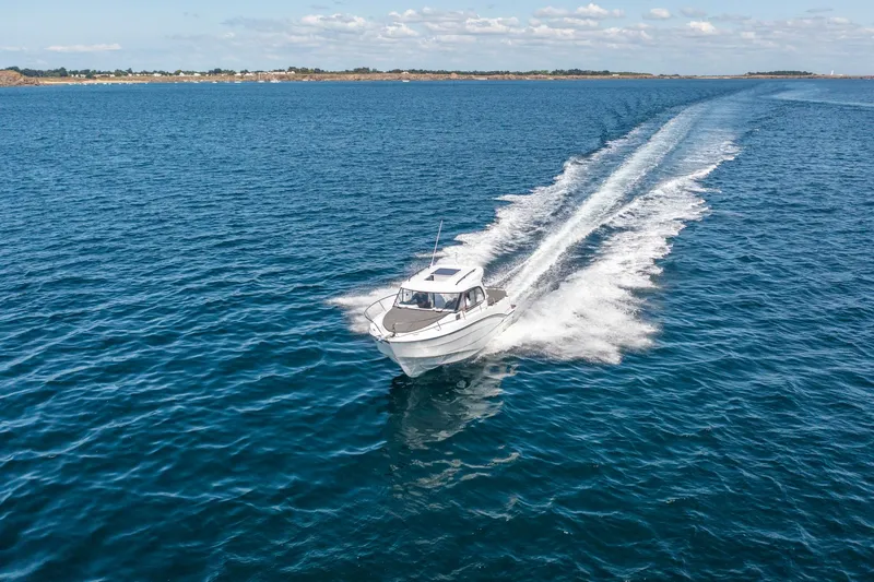 Slide: The Image of 2023 Antares 8 V2 boat cruising on open water. - 19