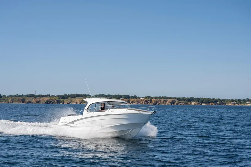 Slide: The Image of 2023 Antares 8 V2 boat cruising on open water. - 20