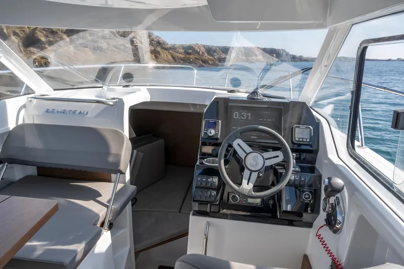 Slide: The Image of 2023 Antares 8 V2 boat cockpit with modern navigation system and steering wheel. - 25