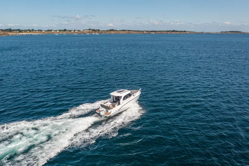 Slide: The Image of 2023 Antares 8 V2 boat cruising on open water. - 9