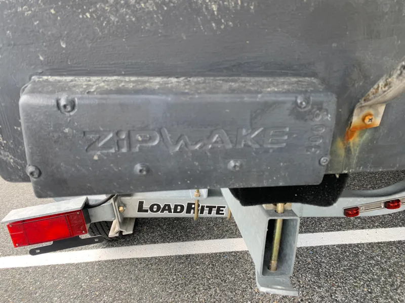 Slide: The Image of Close-up of a Zipwake system on a 2022 Judge 22 Shoreman boat trailer. - 11