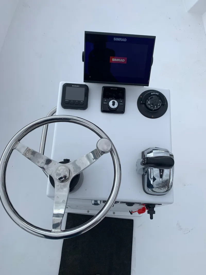 Slide: The Image of Boat helm of 2022 Judge 22 Shoreman with Simrad electronics and steering wheel. - 13