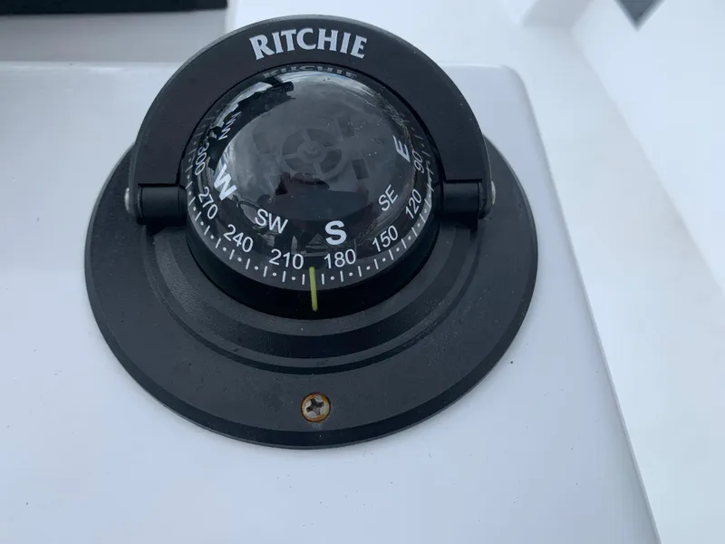 Slide: The Image of Ritchie compass on 2022 Judge 22 Shoreman boat dashboard. - 16