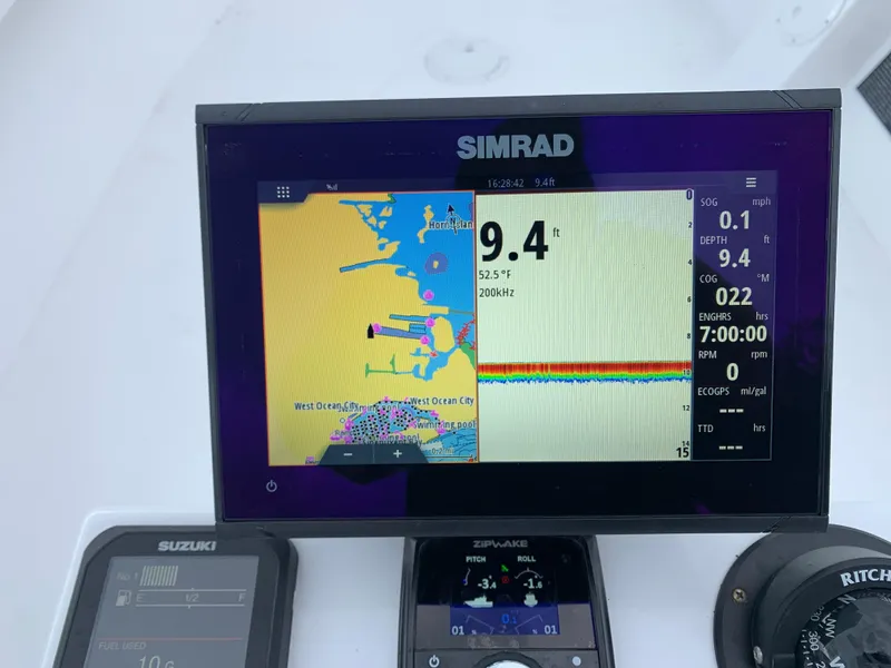 Slide: The Image of Simrad navigation display on 2022 Judge 22 Shoreman boat, showing depth and map details. - 17