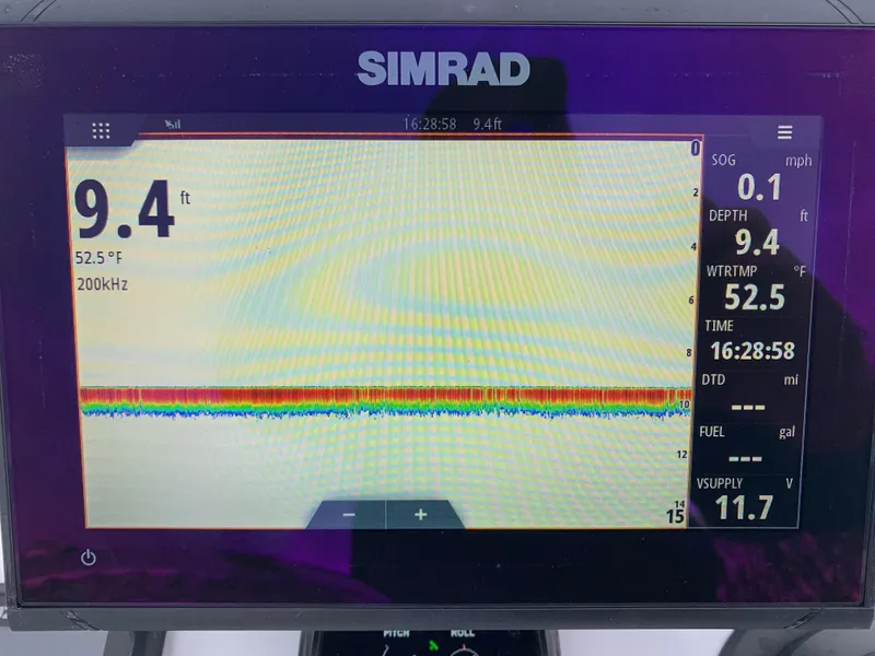 Slide: The Image of Simrad marine display showing depth, water temperature, and speed on a Judge 22 Shoreman boat. - 19