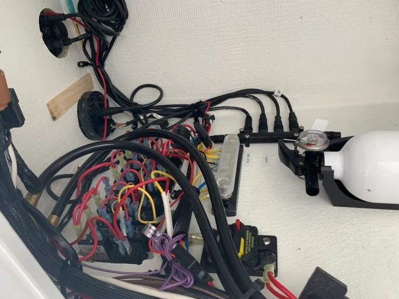 Slide: The Image of Electrical wiring and components inside a 2022 Judge 22 Shoreman boat. - 22