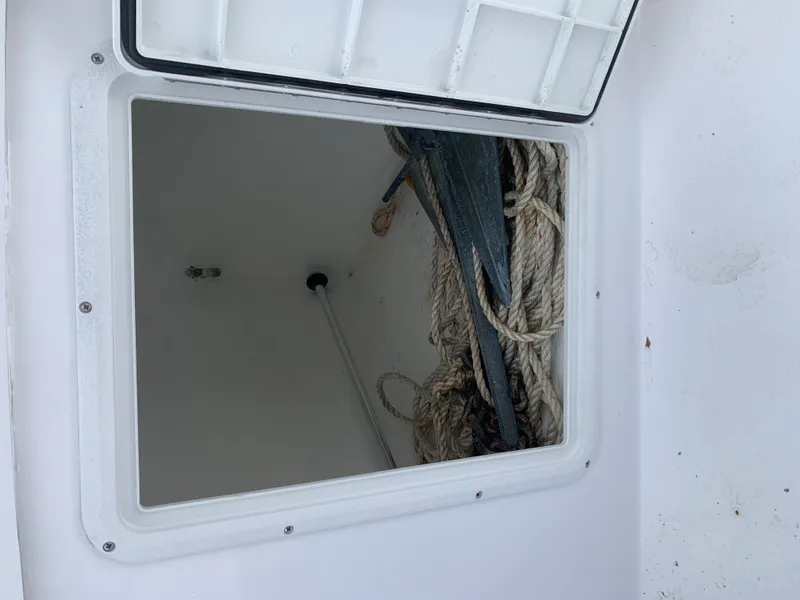 Slide: The Image of Anchor and ropes in storage compartment of 2022 Judge 22 Shoreman boat. - 27