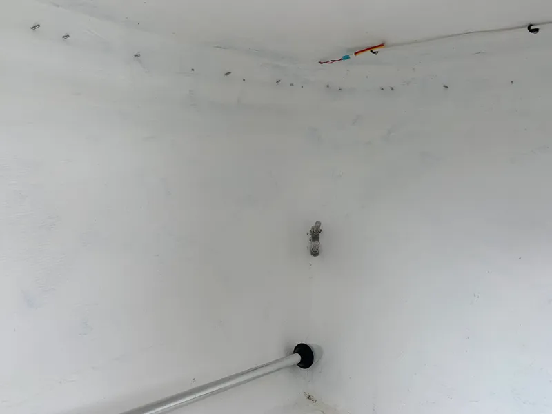 Slide: The Image of Interior of 2022 Judge 22 Shoreman boat, showing white walls and metal fixtures. - 28