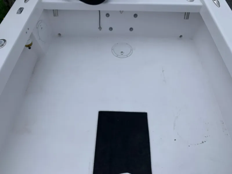 Slide: The Image of Interior view of a 2022 Judge 22 Shoreman boat, featuring a clean, spacious deck. - 34