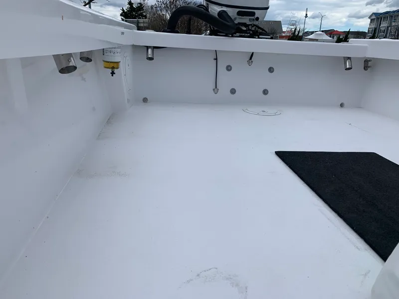 Slide: The Image of Interior view of a 2022 Judge 22 Shoreman boat, showcasing a clean, spacious deck. - 35