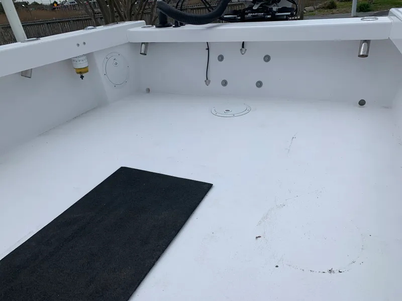 Slide: The Image of 2022 Judge 22 Shoreman boat interior, featuring a clean, spacious deck area. - 36