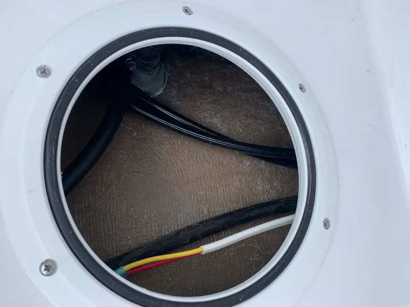 Slide: The Image of Circular hatch with wiring inside a 2022 Judge 22 Shoreman boat. - 40