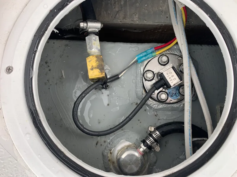 Slide: The Image of Boat fuel tank compartment with wiring and hoses, Judge 22 Shoreman 2022 model. - 41