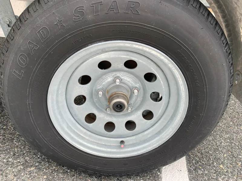 Slide: The Image of Close-up of a Load Star tire on a 2022 Judge 22 Shoreman trailer. - 45