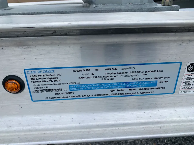 Slide: The Image of Label on Load Rite trailer, detailing specifications and compliance information. - 47