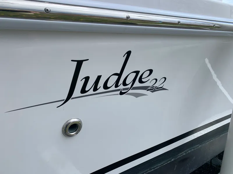 Slide: The Image of 2022 Judge 22 Shoreman boat logo on white hull. - 5