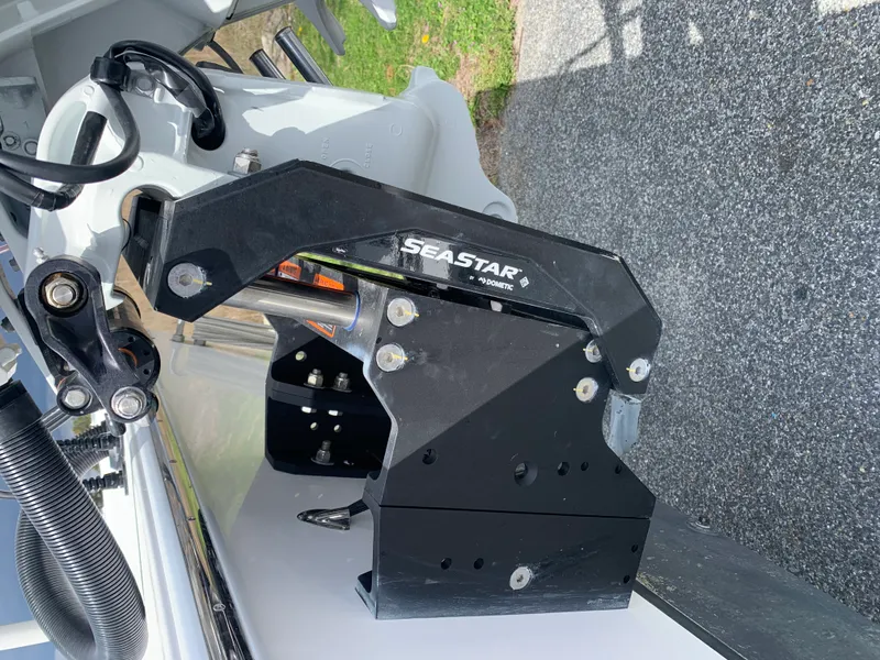 Slide: The Image of Close-up of a 2022 Judge 22 Shoreman boat's SeaStar hydraulic steering system. - 7