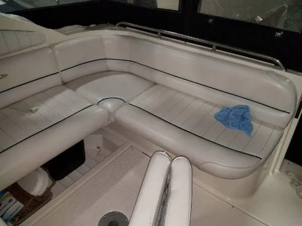 Slide: The Image of 1997 Maxum SCR3000 boat interior with white leather seating. - 17