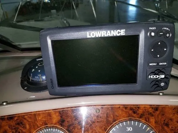 Slide: The Image of Lowrance fish finder on 1997 Maxum SCR3000 boat dashboard. - 5