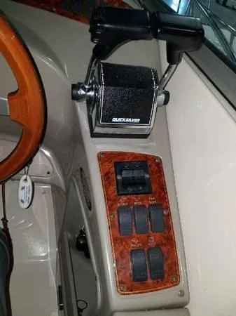 Slide: The Image of 1997 Maxum SCR3000 boat control panel with throttle and switches. - 7