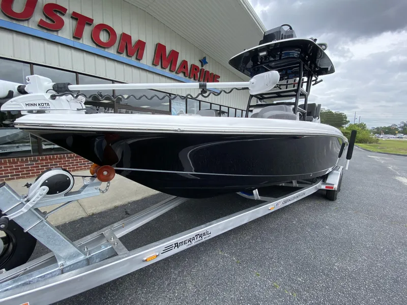Slide: The Image of 2022 Crevalle 26 HCO boat on trailer outside Custom Marine dealership. - 15