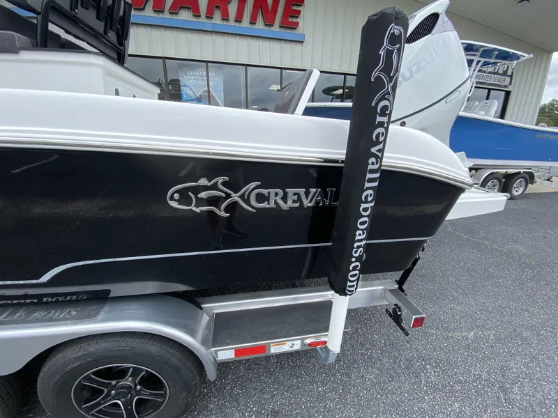 Slide: The Image of 2022 Crevalle 26 HCO boat on trailer at dealership. - 17