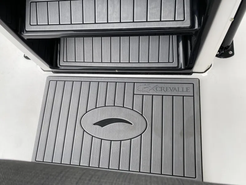 Slide: The Image of 2022 Crevalle 26 HCO boat deck with branded non-slip flooring. - 24