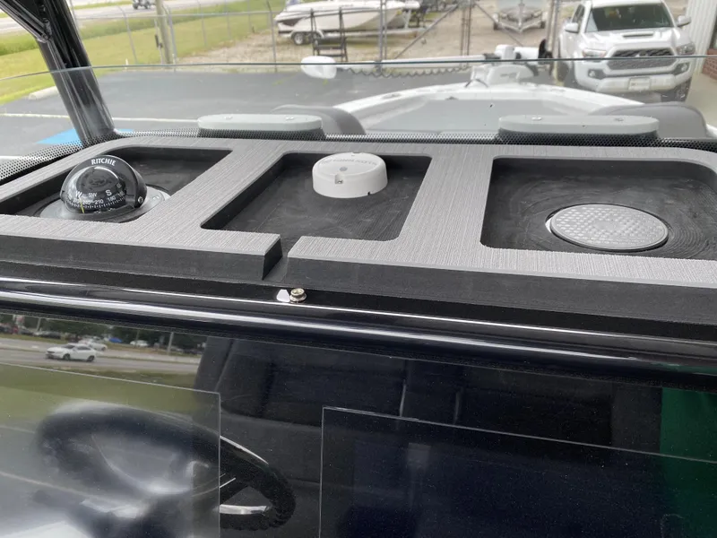 Slide: The Image of 2022 Crevalle 26 HCO dashboard with navigation instruments. - 26