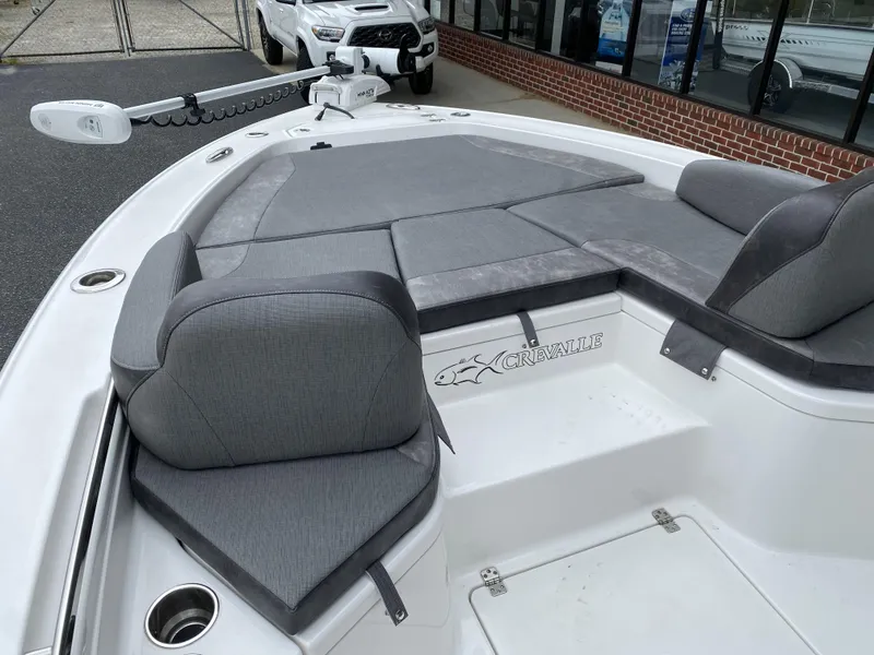 Slide: The Image of 2022 Crevalle 26 HCO boat with gray seating and white deck. - 29