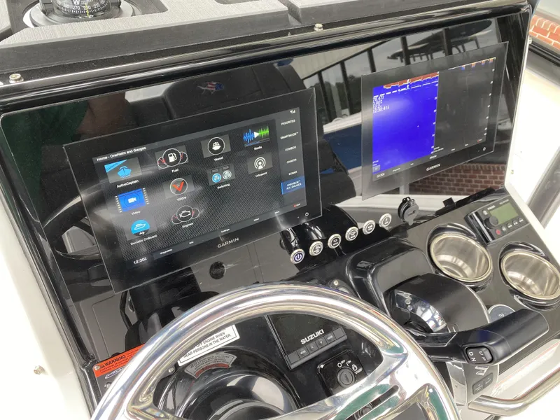 Slide: The Image of 2022 Crevalle 26 HCO boat dashboard with advanced navigation and control systems. - 31