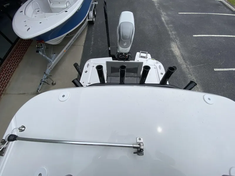 Slide: The Image of Top view of a 2022 Crevalle 26 HCO boat with rod holders and motor. - 32