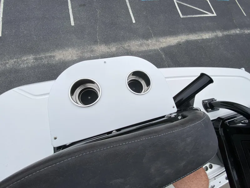 Slide: The Image of 2022 Crevalle 26 HCO boat console with cup holders and seating. - 38