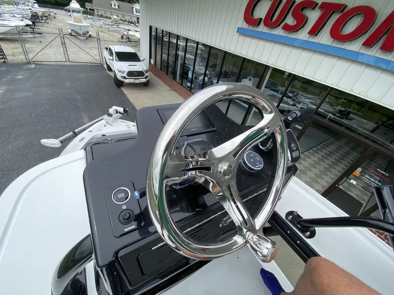 Slide: The Image of 2022 Crevalle 26 HCO boat steering wheel and dashboard at dealership. - 40