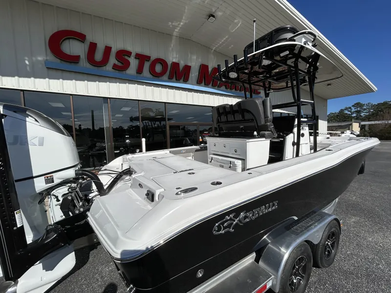 Slide: The Image of 2022 Crevalle 26 HCO boat on trailer outside Custom Marine dealership. - 44