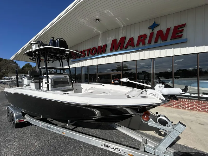 Slide: The Image of 2022 Crevalle 26 HCO boat on trailer outside Custom Marine dealership. - 46